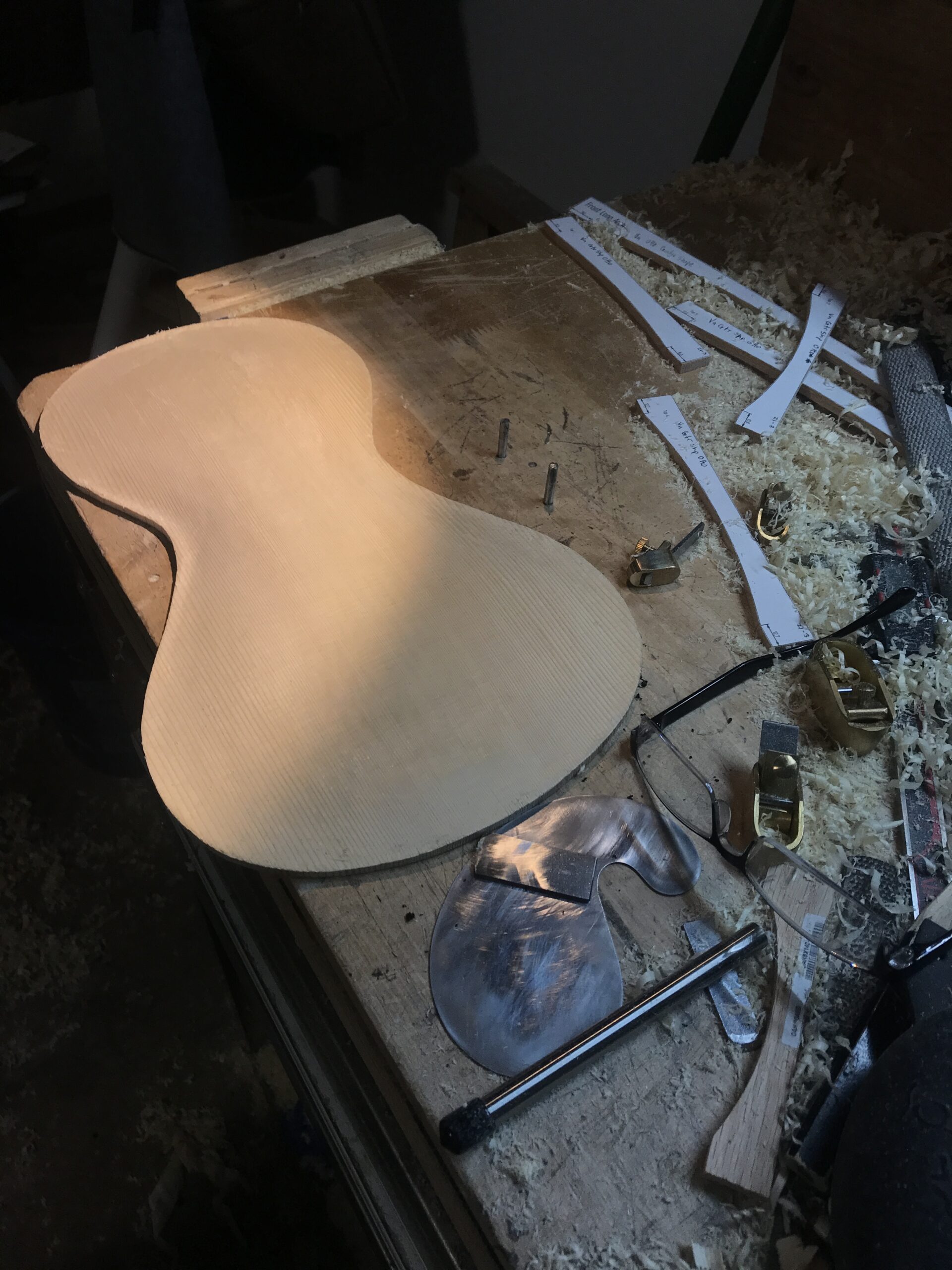 The outside of a violin top plate with the arches being cut